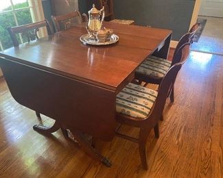 Drop leaf dining table shown with 2 additional leaves 