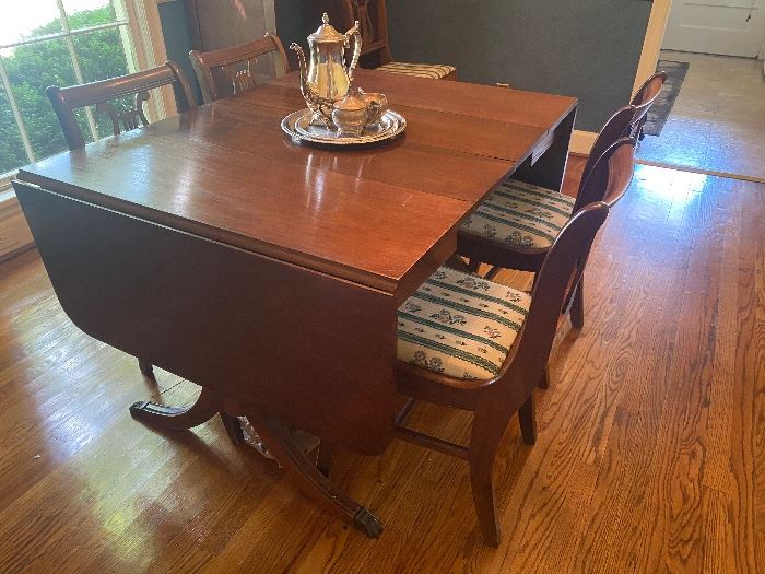 Drop leaf dining table shown with 2 additional leaves 