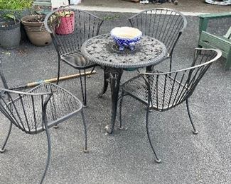 Wrought iron chairs (table is plastic, we know sorry!)