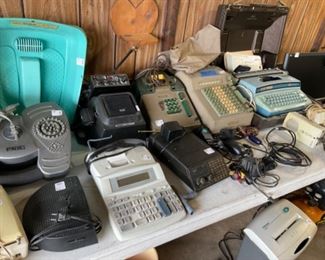 Vintage office machines, typewriter, telephones.