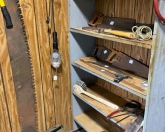 Assorted saws, shop light.