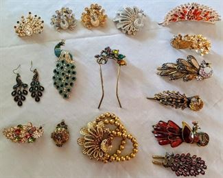 Various pieces of Peacock jewelry: pins, hair clips, locket, earrings, bracelet 