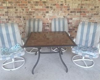 Patio table and 4 rocking swiveling chairs