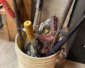 Bucket of Cable Pullers and Crowbars