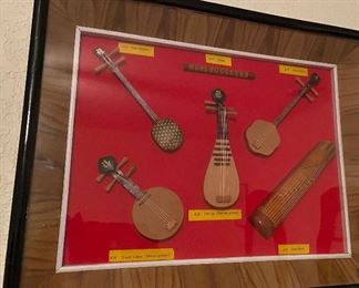 Assorted Wooden Instruments Framed in Shadow Box Style Frame