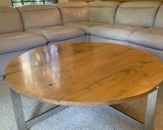 Distressed wood and steel frame Tomlinson brand coffee table. 44” diameter. 15” height. $300