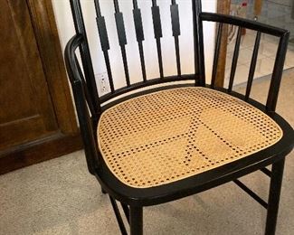 4 Modern Windsor back black ebony chairs with arm rests to match dining table. Cane seats. Michael Taylor for New World Baker $500 each