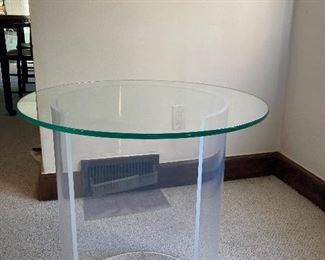 MCM lucite base/glass top side table. Glass top rests on base/not attached with hardware. Diameter of top 22”. Height 22” Diameter of base 16” $200