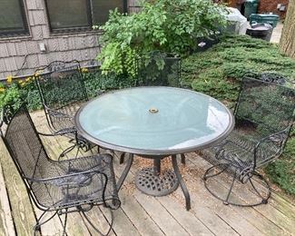 Patio set includes 4 Woodard black tilt metal chairs $125 each
48” diameter brushed steel obscure glass table (not Woodard) $100