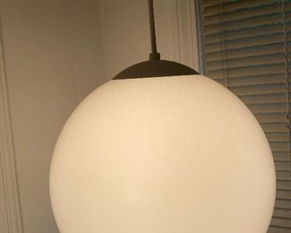 3 white globe hanging light fixtures still in boxes. This one is installed in home for illustration. 
