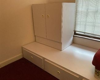 Custom built white melamine twin bed platform set with 2 bed platforms with 1 at 82” long, 1 at 96” long,  square corner platform at 48” long. Width of 41” to fit twin mattress. Each platform has 3 storage drawers. Double door hanging closet. Perfect solution for 12’ long bedroom. $500 for set