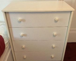 Small white melamine dresser . 4 drawers 27.5” W X 16” D X 32” H $75
