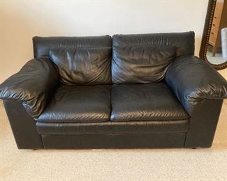 Black leather loveseat 62” L X 35” D X 31” H at back. $400