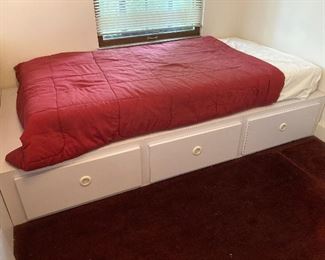 White melamine twin bed platform with 3 drawers included in set for $500. As stand alone, $150