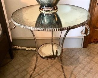 Metal scroll table with antiqued mirror top and bottom shelf