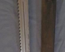 Antique sawback bayonet and scabbard