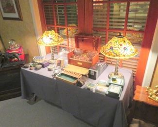 A pair of the many stunning stained glass lamps being offered at this sale