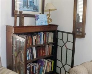 Bookshelf with an eclectic collection of books.