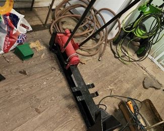 manual log splitter, in outbuilding closest to the house