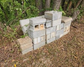 cinder blocks, pads, in yard near parking