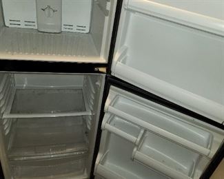 smaller black Whirlpool refrigerator