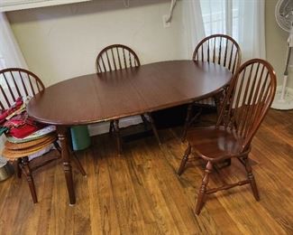 dining table with 4 chairs, pictured with 2 leaves in