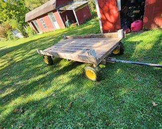large "hay wagon", all 4 wheels turn, hooks to mower