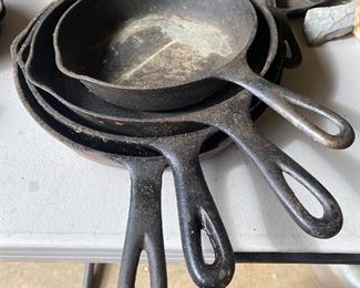 Several Cast Iron Frying Pans