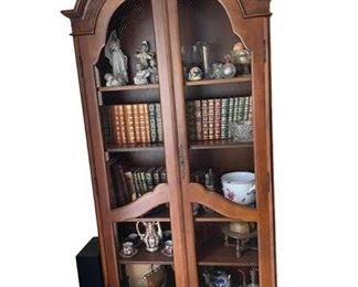 $100 - Arched Top China Cabinet Wire Mesh on Front Panels ES99-9                                                                                                 Description : This arched top cabinet is perfect for a dry bar or a multitude of display and storage needs. Wood framed with a wire mesh fronts temper the formality of this pieces making it a great fit for many different style options. The piece shows wear in a couple of areas where the veneer has peeled.

Condition Desc. : Very Good Condition
Local pick up only : McLean VA.  Contact us for shipper suggestions.

Measurements

Length : 36
Width : 13
Height : 79