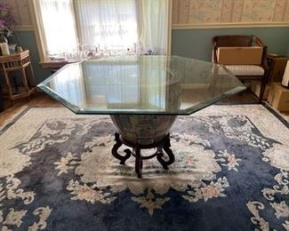 $400 - Asian Drum Porcelain Base Glass Top Dining Table MF95-15                                                                                           A Chinese porcelain base pedestal and glass top dining table. This hexagon-shaped Chinese table features a glass top over a large porcelain urn / vase. The base of the table is raised upon the typical Chinese solid wood Ming style wooden stand. This fantastic table would work great in a dining room surrounded by 4 -6 chairs.

Base 20 x 18"H

LOCAL PICK UP MCLEAN VA. Please contact us for Shipper Suggestion.

48"L x 48"W x 28.5"H