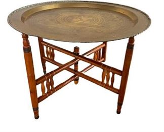 $155 - Folding Brass tray Top Coffee Table with Folding Wood Base  MF95-17                                                                  Description : Vintage Moroccan Incised Brass Tray Table With Foldable Base Made in Hong Kong. Detail on brass tray and on carved folding wooden base. Tray rest inside the base.

Local Pick up McLean, VA.  Contact us for shipper suggestions.

Condition Desc. : Good Condition
Location : McLean VA


Length : 30
Height : 22