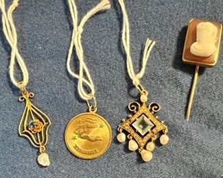 Antique Pendant (far left)                                                                                     14K Aquarius Pendant (2nd from left)                                                                                            Antique 14K Pearl & Aquamarine Pendant (3rd from left)                                                                                                                                            Late 19th c. 10K Stick Pin (right)