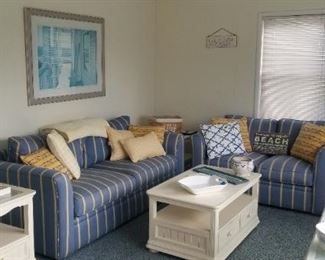 Classic coastal couches by Braxton Culler; white coffee table with storage drawers