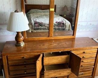 Nice Broyhill dresser and mirror $100 with hidden drawers displayed.