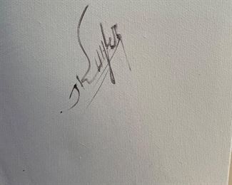 Signature on light purple painting