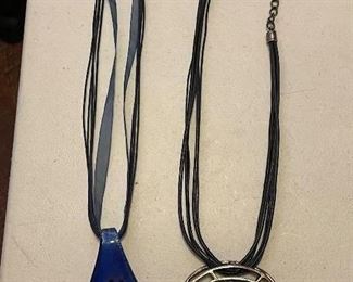 Blue & silver pendant necklace, $12.  Black & silver pendant necklace, $13