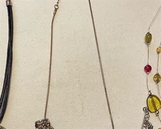 Necklace w/ crescent pendant, $10