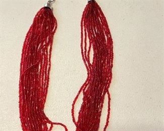 Red multi strand beaded necklace, $10