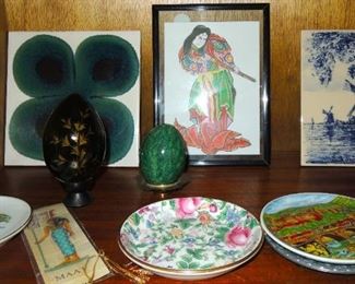 Ceramic tiles, coasters, small saucers and framed postcards from around the world