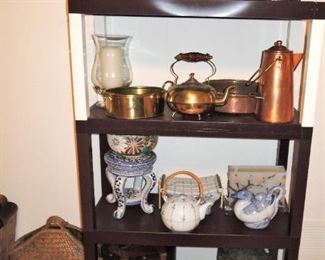 Copper items: pitchers, coffee and tea kettles, bowls, pans and ladles.  Large wood carved containers and baskets.  Blue and white pedestals and tea pots