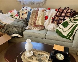 Coffee table end tables sofa and quilts


