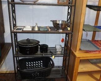 bakers rack, microwave, basket, crock pot, kitchen items