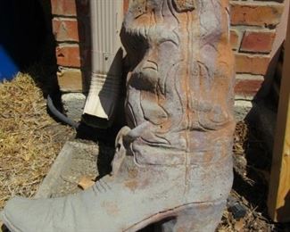 LOOK WHAT BIG TEX LEFT IN OUR GARDEN THE CERAMIC BOOT MEASURES 18” X 9” X 21”