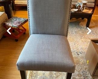 gray upholstered, studded desk chair