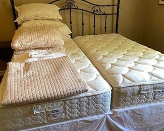 King size bedding: spread and matching square pillows, dust ruffle, sheet set, shams, & king size pillows.  The headboard, mattress, and box springs are not available.