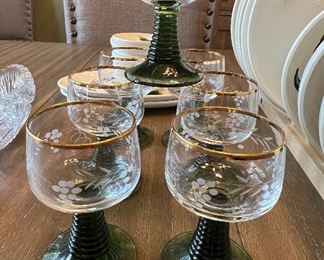 Green and etched gold rimmed wine glasses