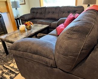 Never used Signature Ashley furniture set - sleeper couch, loveseat, coffee table, rug - tags still on