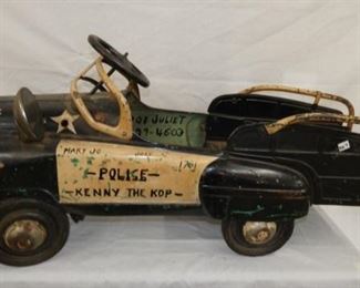 EARLY SAD FACE POLICE PEDAL CAR