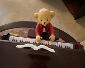 Teddy Takes Requests Musical - Put one of the six hats on his head and he will play tunes of the genre.