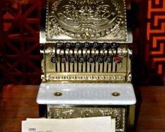 Cash register brass